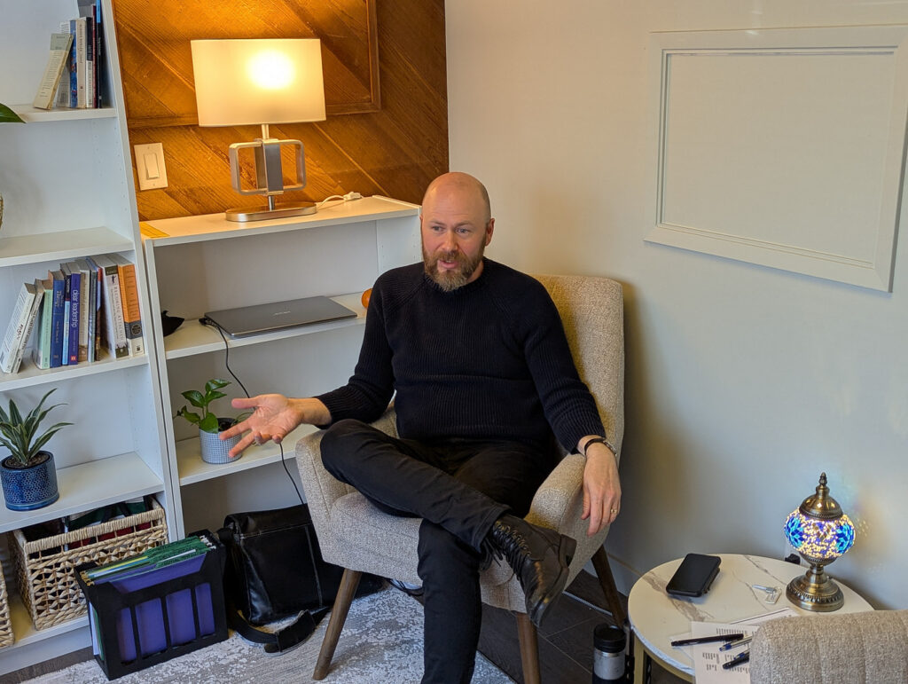 A male counsellor in a couples counselling session