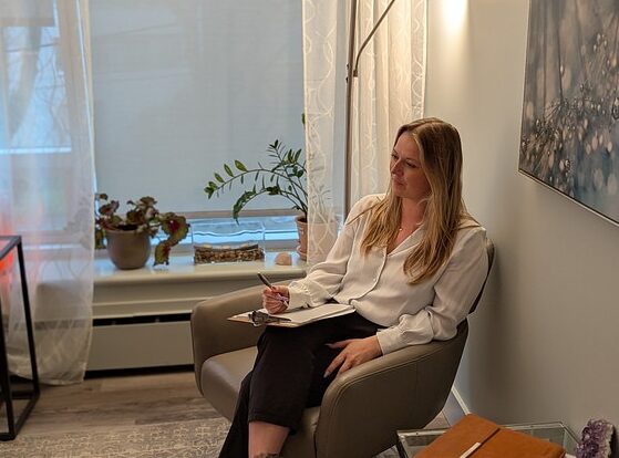 A female therapist listening to a client during a session