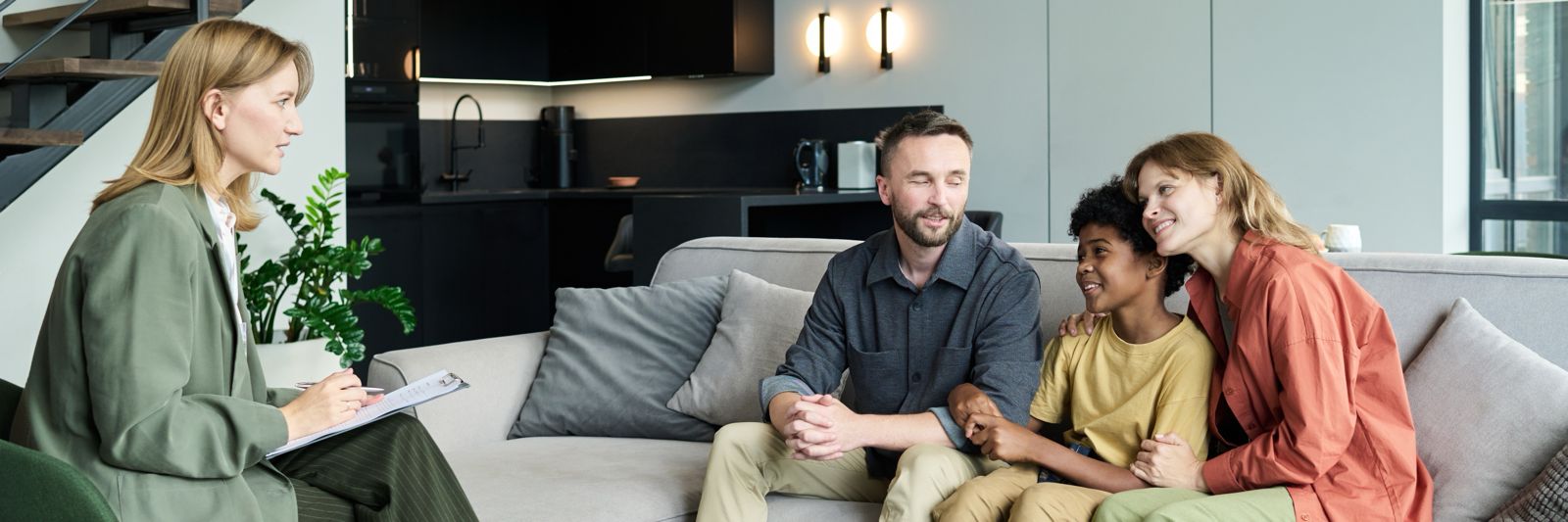 Family consultation in modern living room.